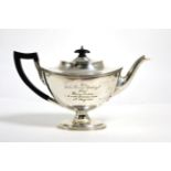 A silver teapot marked for London with presentation inscription