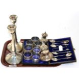 A cased set of six silver apostle spoons with matching tongs, seven various silver napkin rings, a