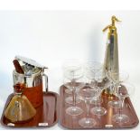 A group of Art Deco style items comprising, a soda syphon, an ice bucket, liquor decanter and nine