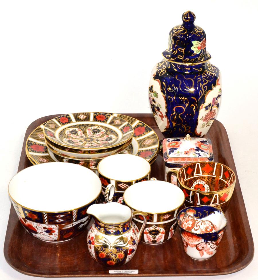 A pair of Royal Crown Derby Imari palette plates; together with two cups and saucers and a 19th