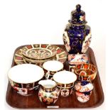 A pair of Royal Crown Derby Imari palette plates; together with two cups and saucers and a 19th