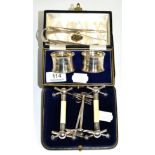 A cased pair of silver mounted ivory knife rests, Sheffield 1896, a pair of later silver knife