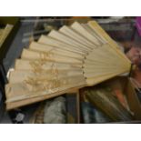 Circa 1860s bone fan, with pierced and carved guards and gorge, with a double fabric leaf,