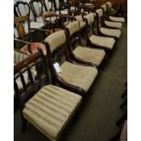 A set of six Regency mahogany dining chairs, together with a similar pair of carvers, and two