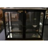 Late 19th century ebonised table top shop display cabinet, with four glazed sizes, two glass shelves