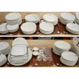 Large quantity of dinner wares printed with family crests (seven trays)