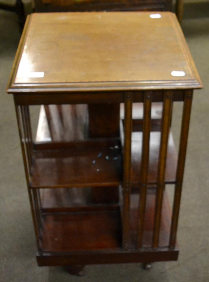 An Edwardian mahogany and satinwood banded revolving bookcase, early 20th century, with slatted