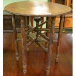 A 19th century inlaid oak circular occasional table with folding stand