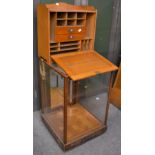 Mid 20th century shop display cabinet with three glazed sides and to the top, mahogany door to the