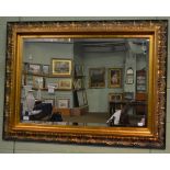 A reproduction gilt bevelled glass mirror, with rectangular plate and acanthus decorated frame,