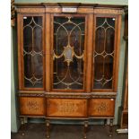 A reproduction parcel gilt and inlaid English display cabinet