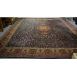 A machine made carpet of Oriental design, 408cm by 365cm