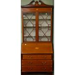 An inlaid mahogany astragal glazed bureau bookcase