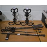 A cast iron Arts & Crafts fire side set comprising, andirons, tongs, poker, shovel and poker stand