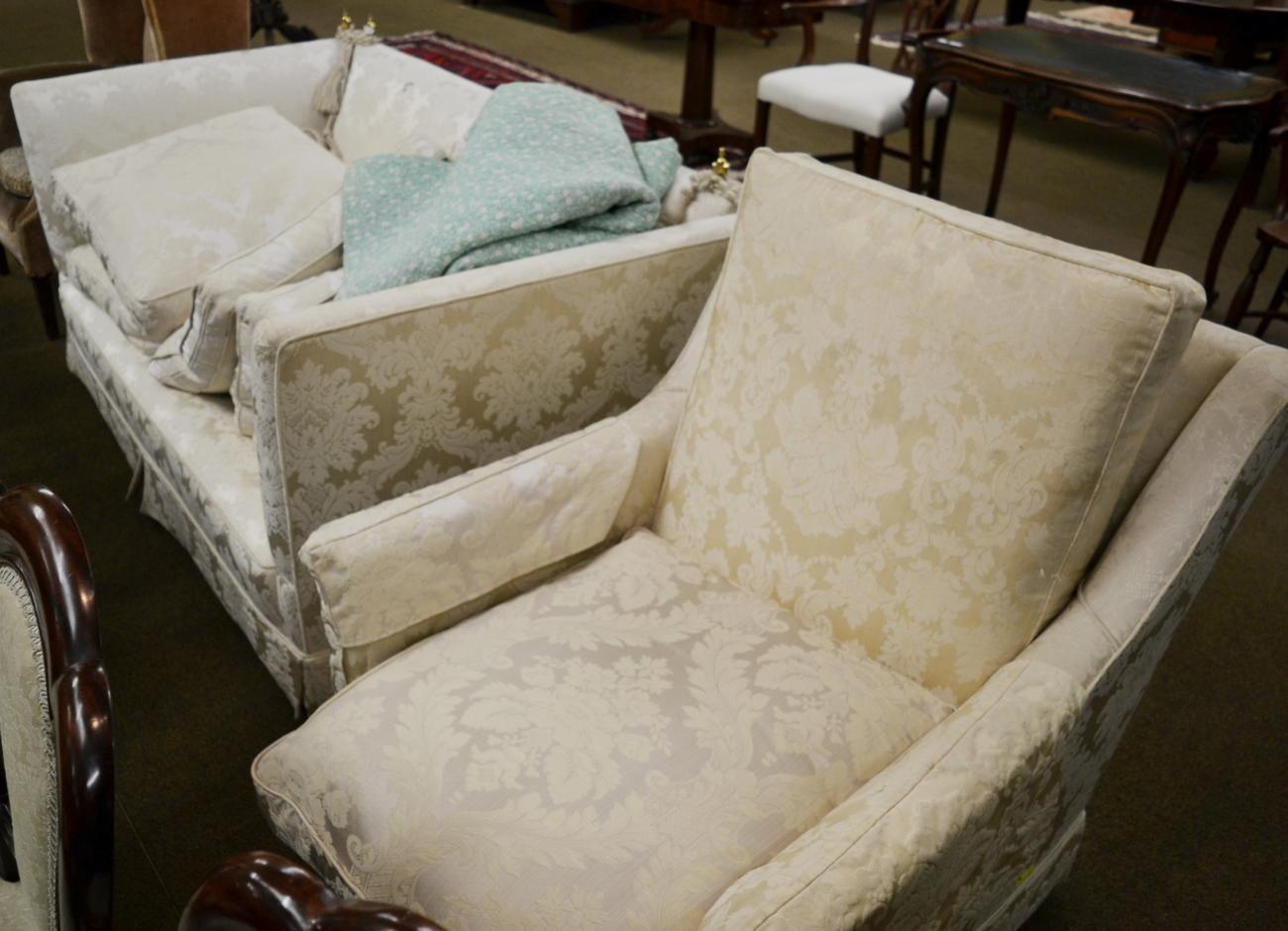 Knoll style drop end sofa upholstered in cream floral fabric; and an armchair upholstered to match