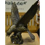 A patinated model of an eagle with wings outstretched
