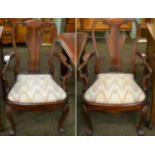 A pair of 19th century walnut open armchairs