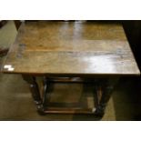 An oak side table with rectangular top raised on turned legs, 17th century in part