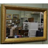 A gilt framed rectangular mirror