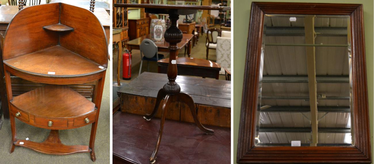 George III mahogany bow fronted washstand; a mahogany tripod table; and a walnut mirror with