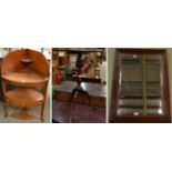 George III mahogany bow fronted washstand; a mahogany tripod table; and a walnut mirror with