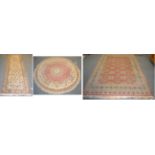 An Indian 'Bukhara' carpet, the terracotta filed of guls enclosed by multiple borders, 267cm by
