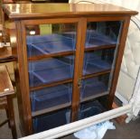 Mahogany glazed bookcase, circa 1900, enclosing three shelves