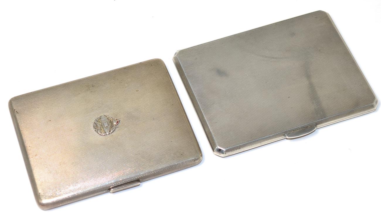 An engine turned silver cigarette case with Royal Tank Corps badge, London 1938; and another
