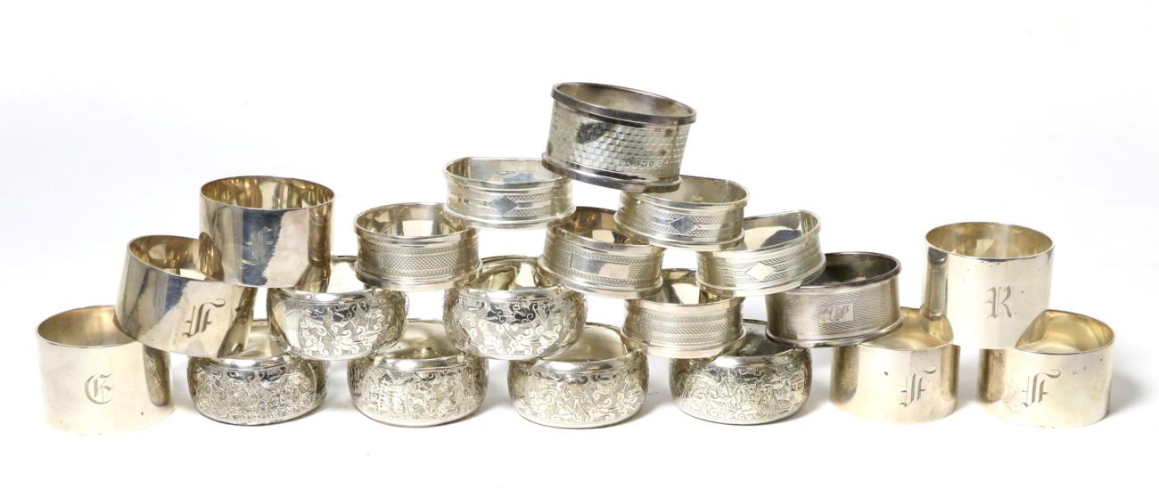 A group of twenty assorted silver napkin rings; including a set of six with foliate engraving