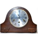 A 1920s Guta oak cased chiming mantel clock