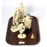 A group of four Meiji Period Japanese ivory okimonos; and a netsuke of similar date