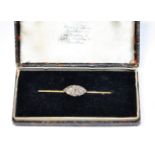 A diamond bar brooch, a navette-shaped plaque pavé set with old cut diamonds, to a flat sided bar,