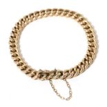 A curb link bracelet, 18.5cm long approximately, stamped '15'16.2g