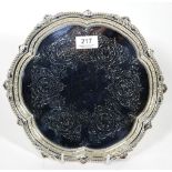 A late Victorian silver salver, Mappin Bros, Sheffield 1899, shaped circular with folaite and bead