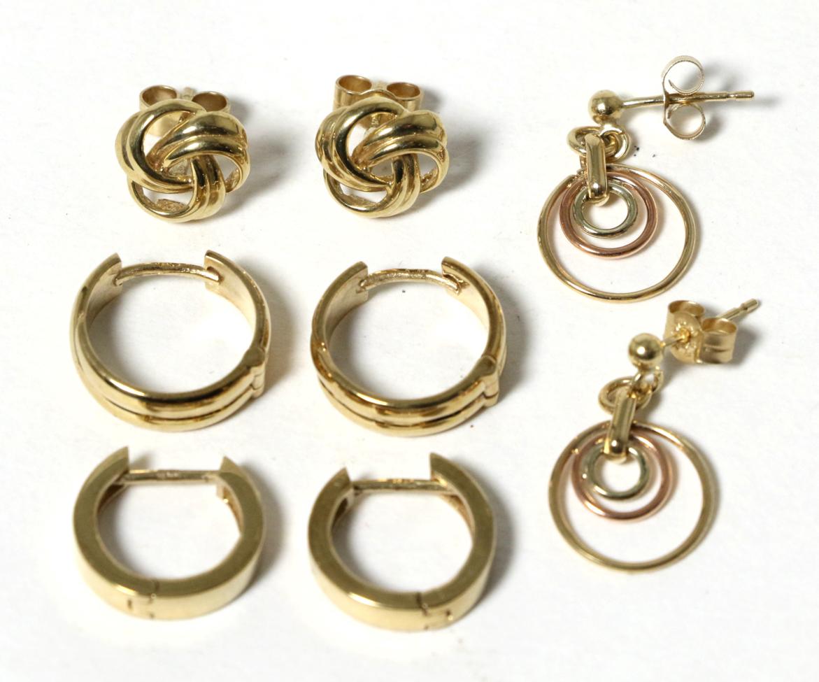 Four pairs of 9 carat gold earrings, comprising two pairs of hoop earrings, a pair of drop