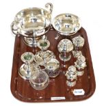 Small group of silver including a twin-handled footed dish; bonbon dish raised on three feet; pair