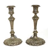 A pair of Victorian Elkington electroplated cast candlesticks, date code for 1856, in the Gothic