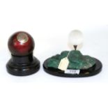 A presentation cricket ball and golf ball crystal