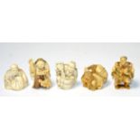 Five Japanese Meiji period carved ivory netsukes in the form of various traders (5)