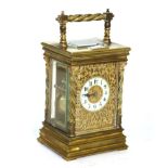 A glass and brass striking mantel timepiece, movement back plate stamped R & Co. Paris, for