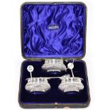 A late Victorian silver three piece condiment set, Mark Willis, Sheffield 1897, part fluted, with