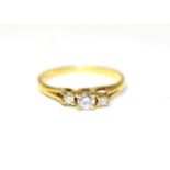 An 18 carat gold diamond three stone ring, graduated round brilliant cut diamonds in claw