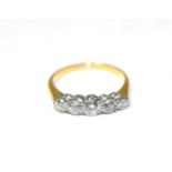 A diamond five stone ring, graduated transitional cut diamonds, in claw settings, to knife edge