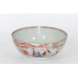 A Chinese Qing Long period famille rose bowl decorated with figures in a landscape