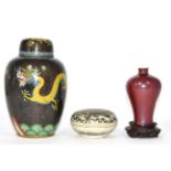 A Chinese porcelain box and cover; a flambe glaze small baluster vase; and a cloisonne jar and cover