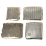 Four engine turned silver cigarette cases, the largest 10cm wide, 13.8ozt
