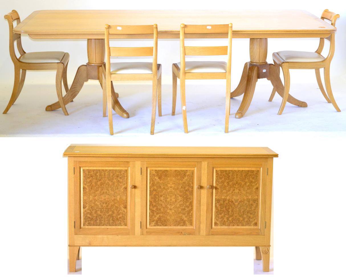 Andrew Conning Tancred; An Oak Butterfly Dining Suite, comprising a twin pillar dining table,