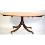 A Reproduction Satinwood and Crossbanded Oval Dining or Breakfast Table, in George III style, raised