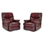 Sherborne Upholstery Ltd: A Pair of Maroon Leather Reclining Easy Chairs, with rounded arms and