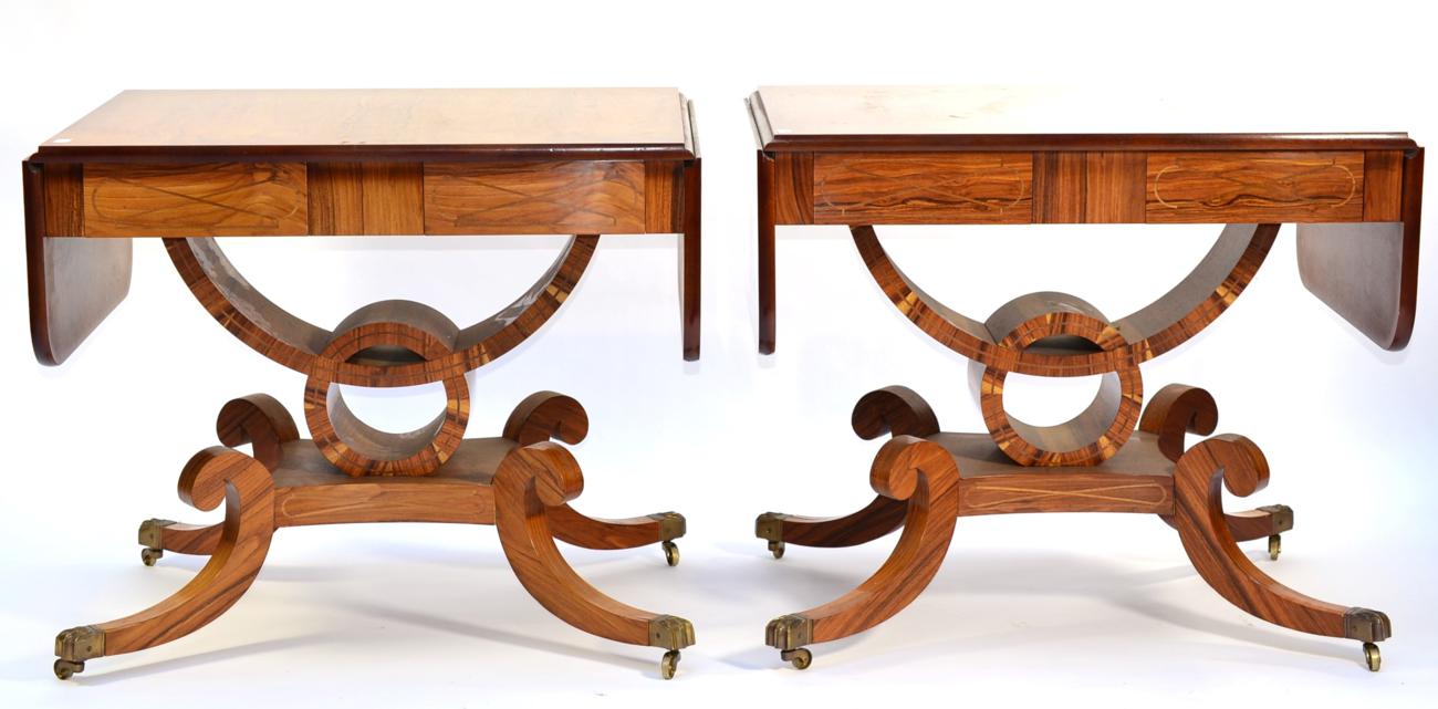 A Pair of Reproduction Sofa Tables, in Regency style, each with rounded drop leaves above two real